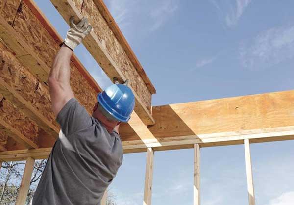 Operative fixing insulation board and OSB to external timber wall frame from outside