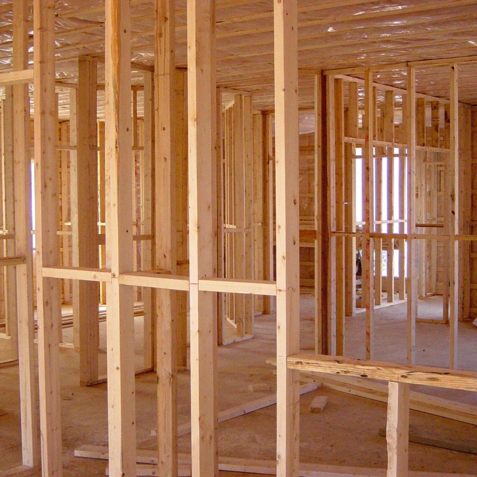 Wide view of timber stud framing throughout an open-plan new-build shell