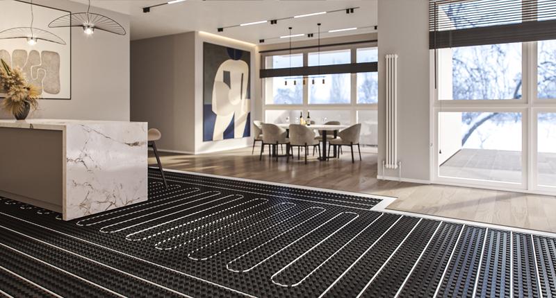 Underfloor heating mat laid on dark subfloor in a modern open-plan living space